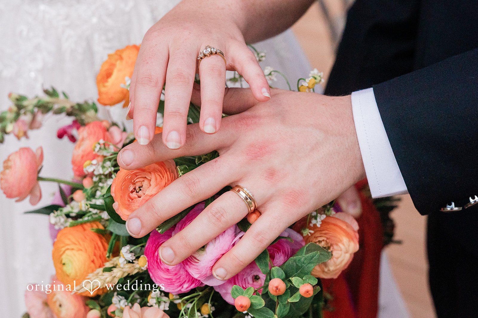 Beautiful picture of hands of bride and groom with wedding rings on them