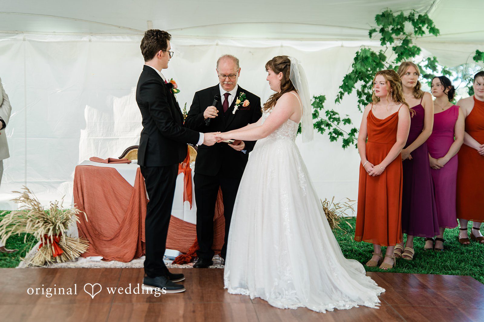 Bride and groom exchanging wedding vows during wedding ceremony