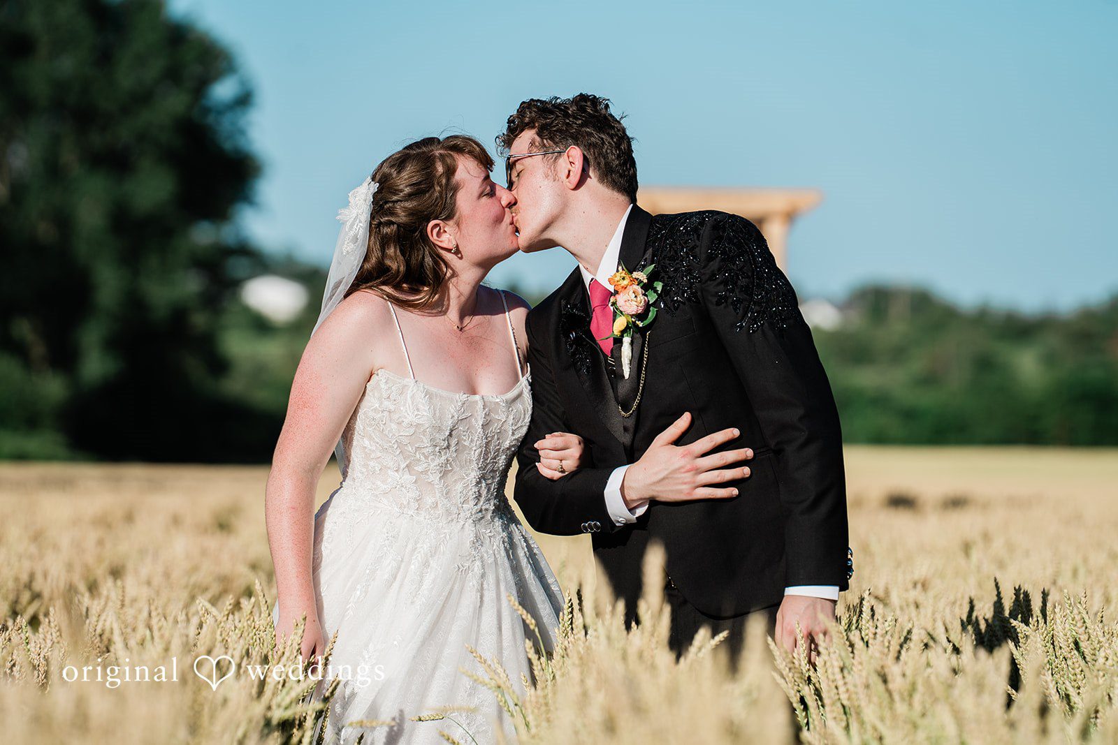 Bride and groom sharing a romantic kiss