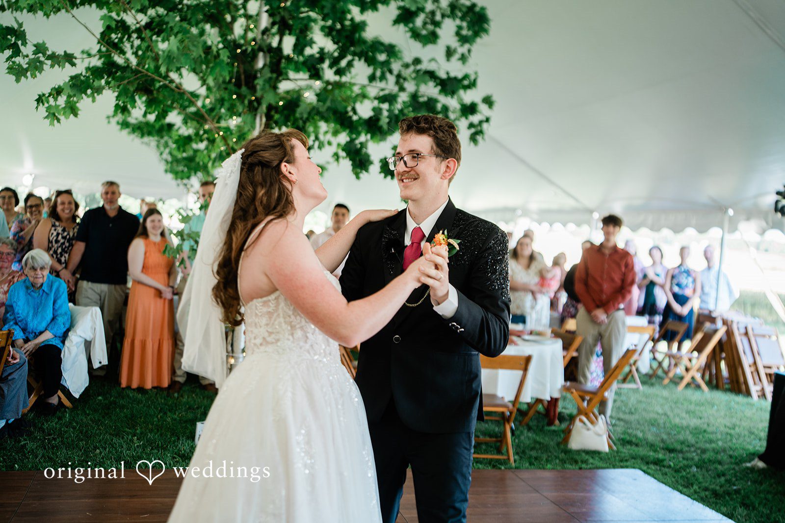 Bride and groom sharing a romantic dance in wedding reception