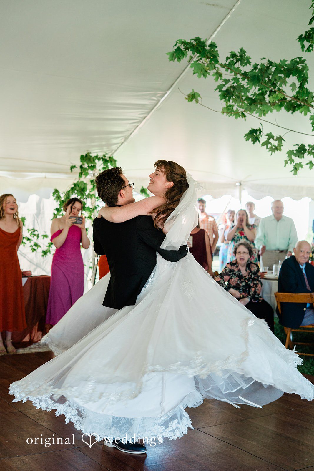 Bride and groom sharing a romantic dance in wedding reception