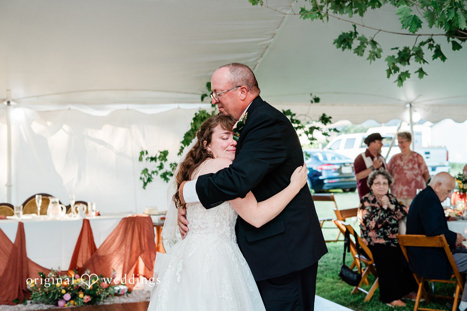 Bride sharing an emotional dance with someone