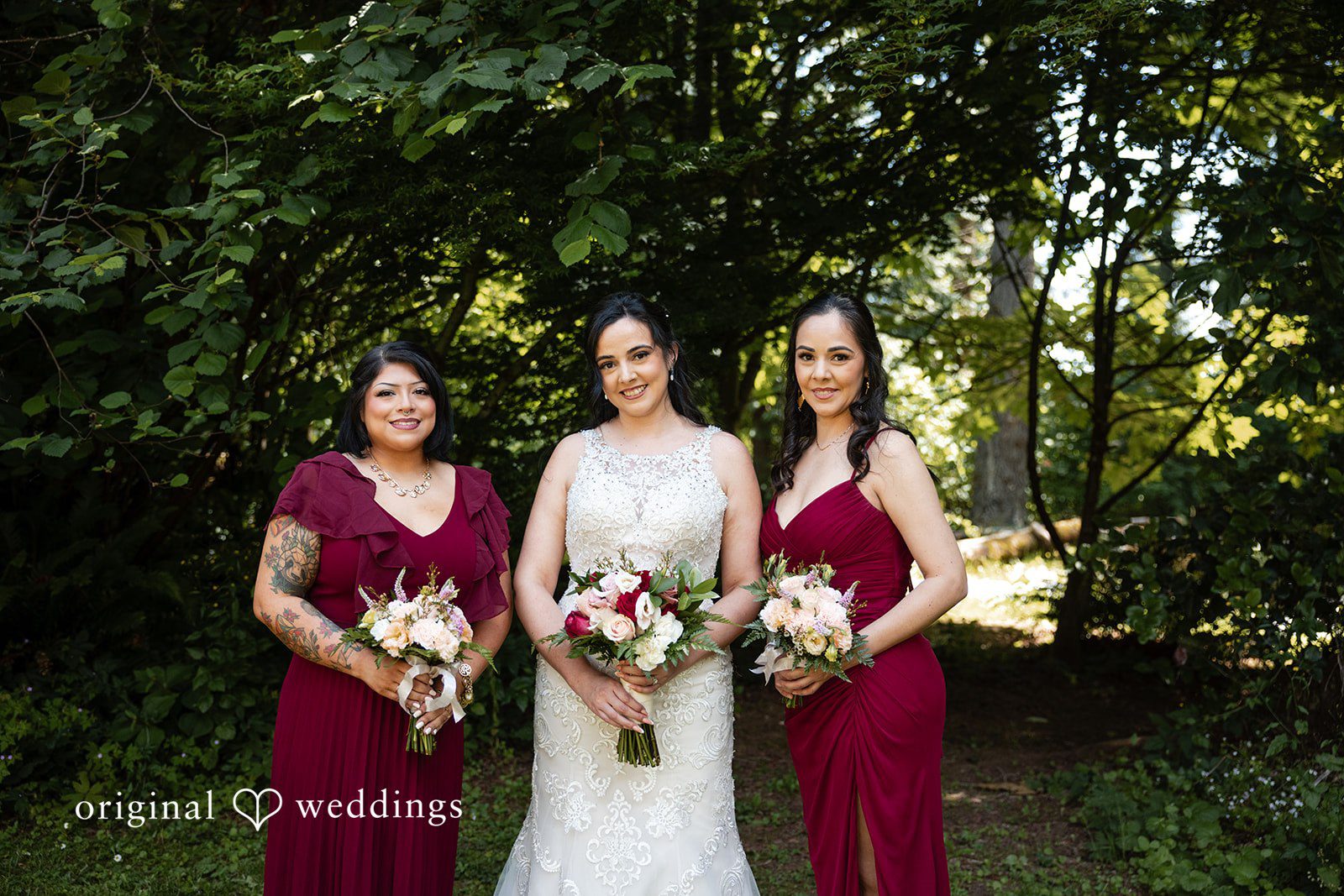 Bride smiling with bridesmaids before ceremony