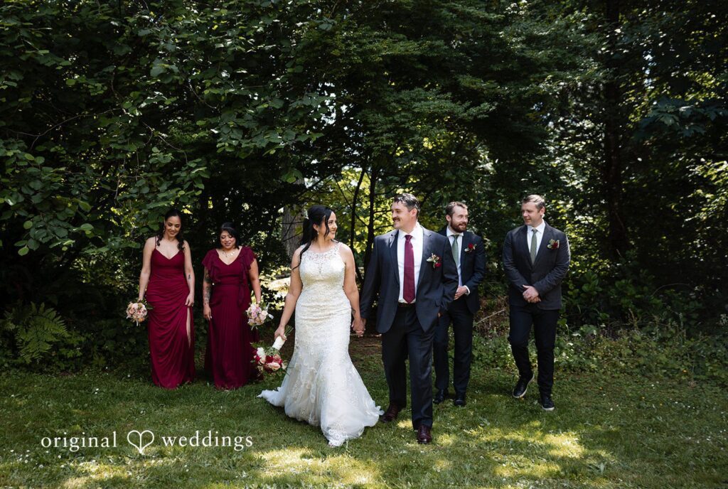 Portland Wedding Photographers capturing couple group photo with bridesmaids and groomsmen by Original Weddings