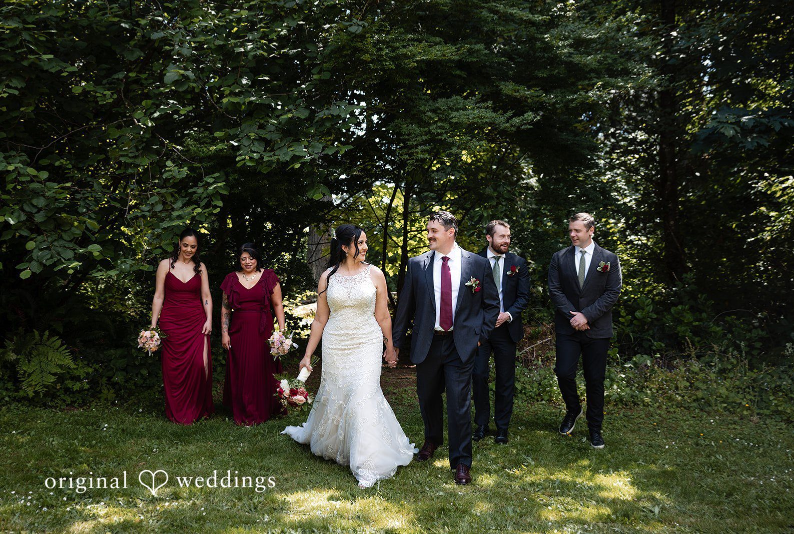 Portland Wedding Photographers capturing couple group photo with bridesmaids and groomsmen by Original Weddings