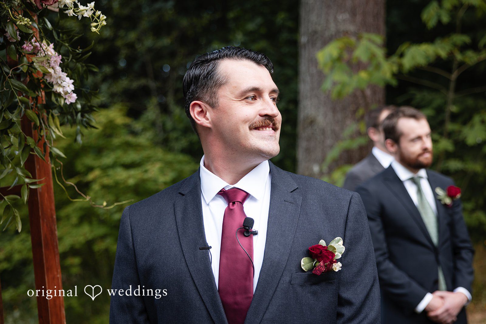 Groom admiring bride entrance while smiling