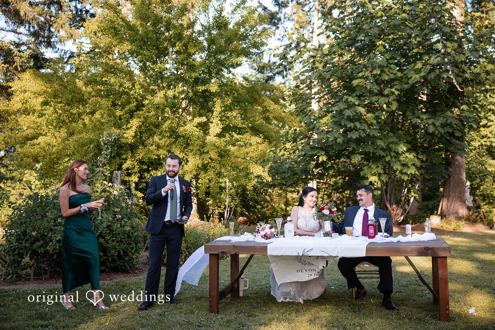 Portland Wedding Photographers capturing couple sitting at reception table by Original Weddings