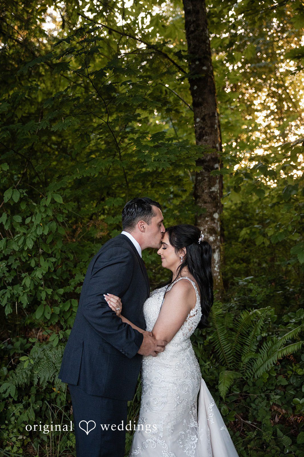 Sweet forehead kiss moment
