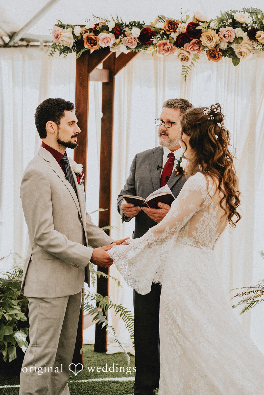 Catherine + Gabriel Officiant standing with the bride and groom during the vows.