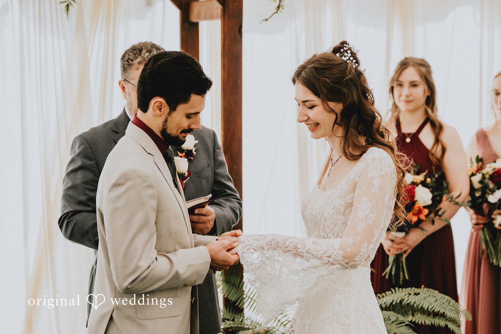 Catherine + Gabriel Groom placing a wedding ring onto the bride's finger.