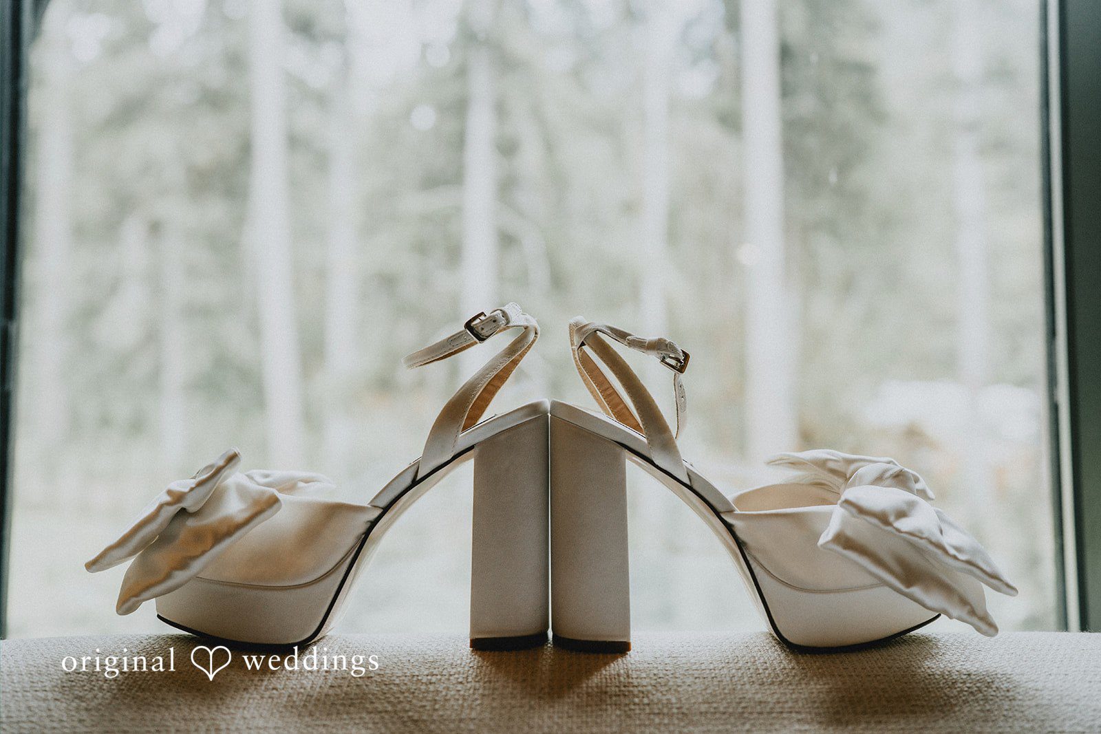 Ben + Erin Close up shot of bridal shoes placed in a stylish way