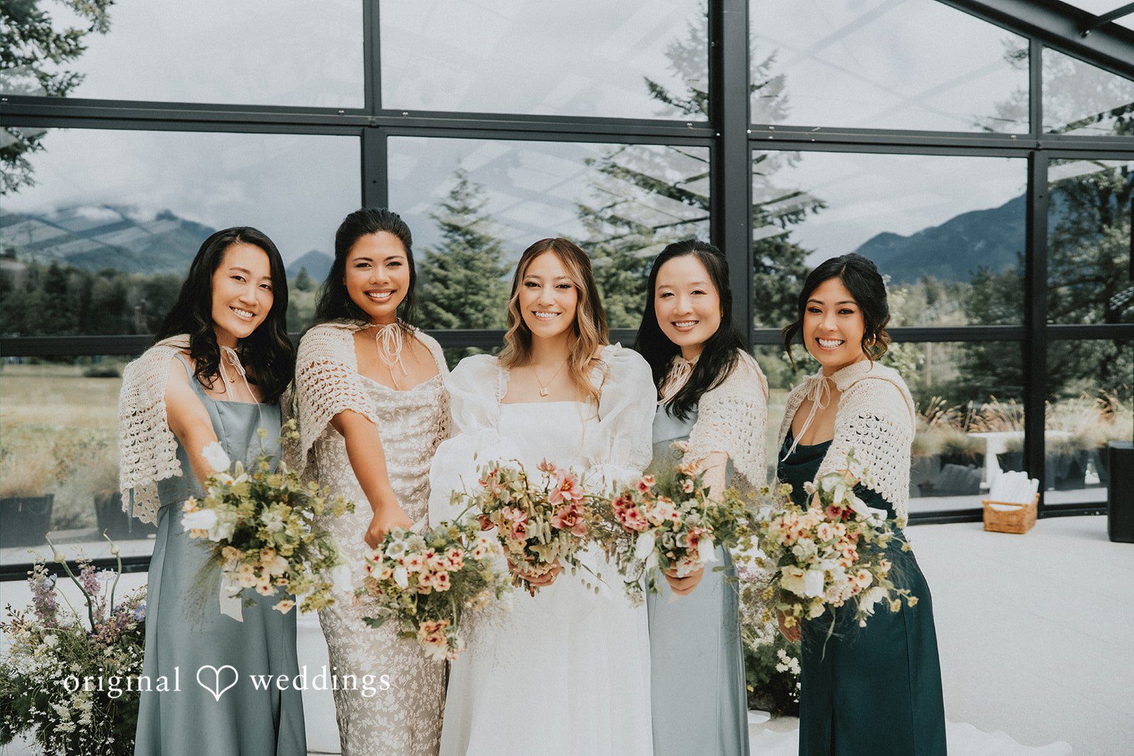 Ben + Erin Beautiful picture of bride with bridesmaids, all smiling and holding bouquet