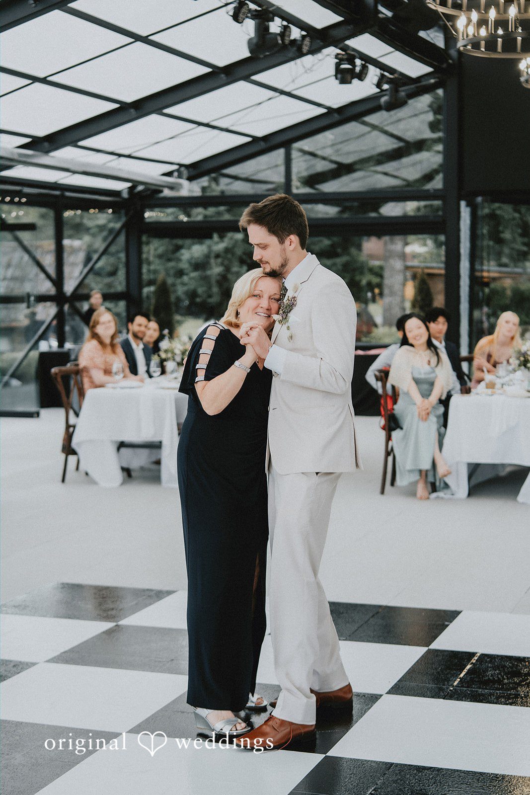 Ben + Erin Groom sharing an emotional dance with someone