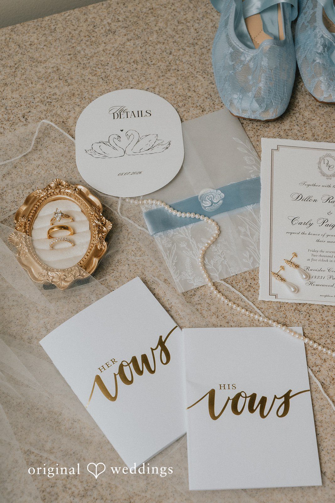 Carly + Dillon A collection of wedding stationery, including a customized invitation card and a vow booklet.