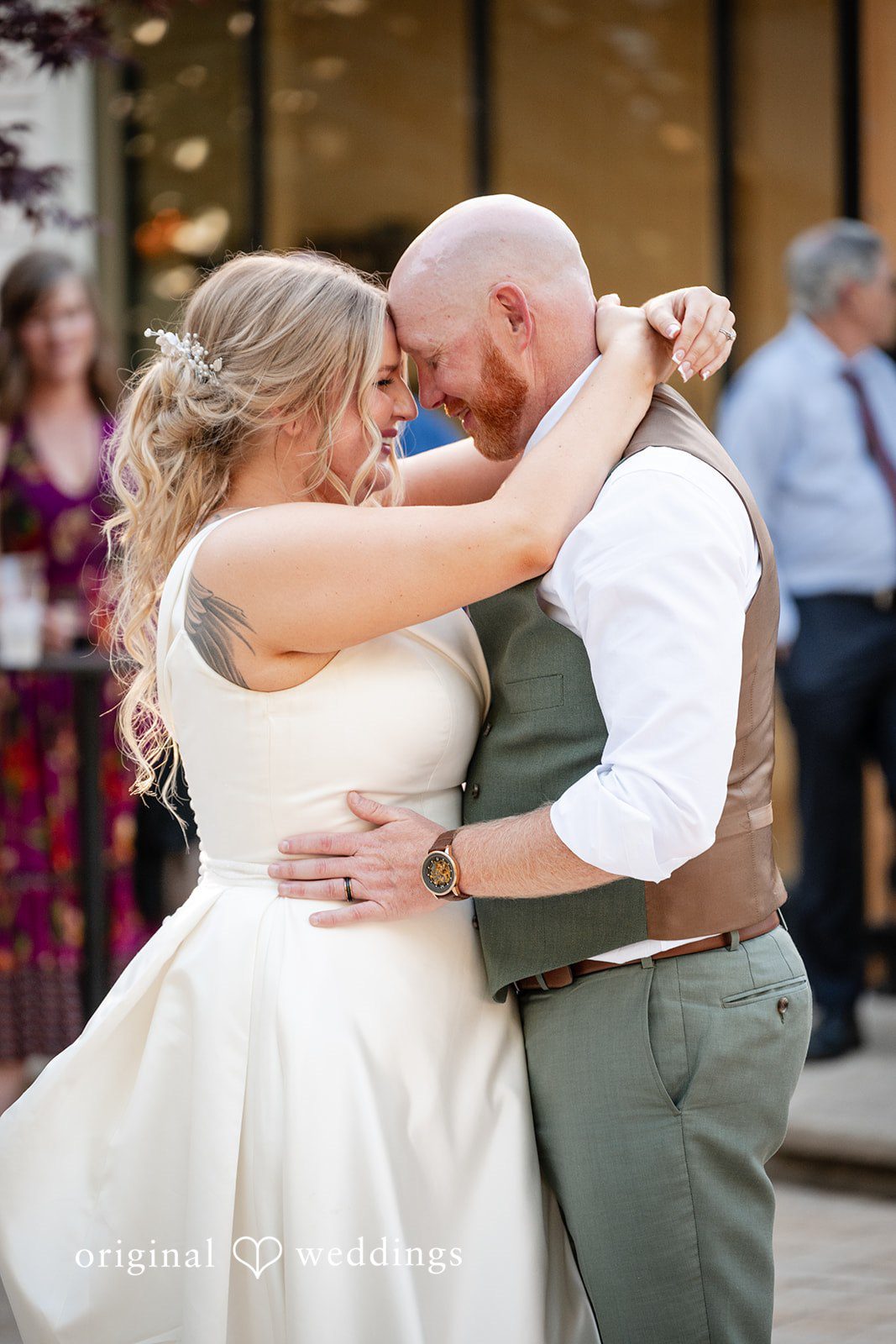 Victoria + Skyler Bride and groom embracing closely during a slow dance.