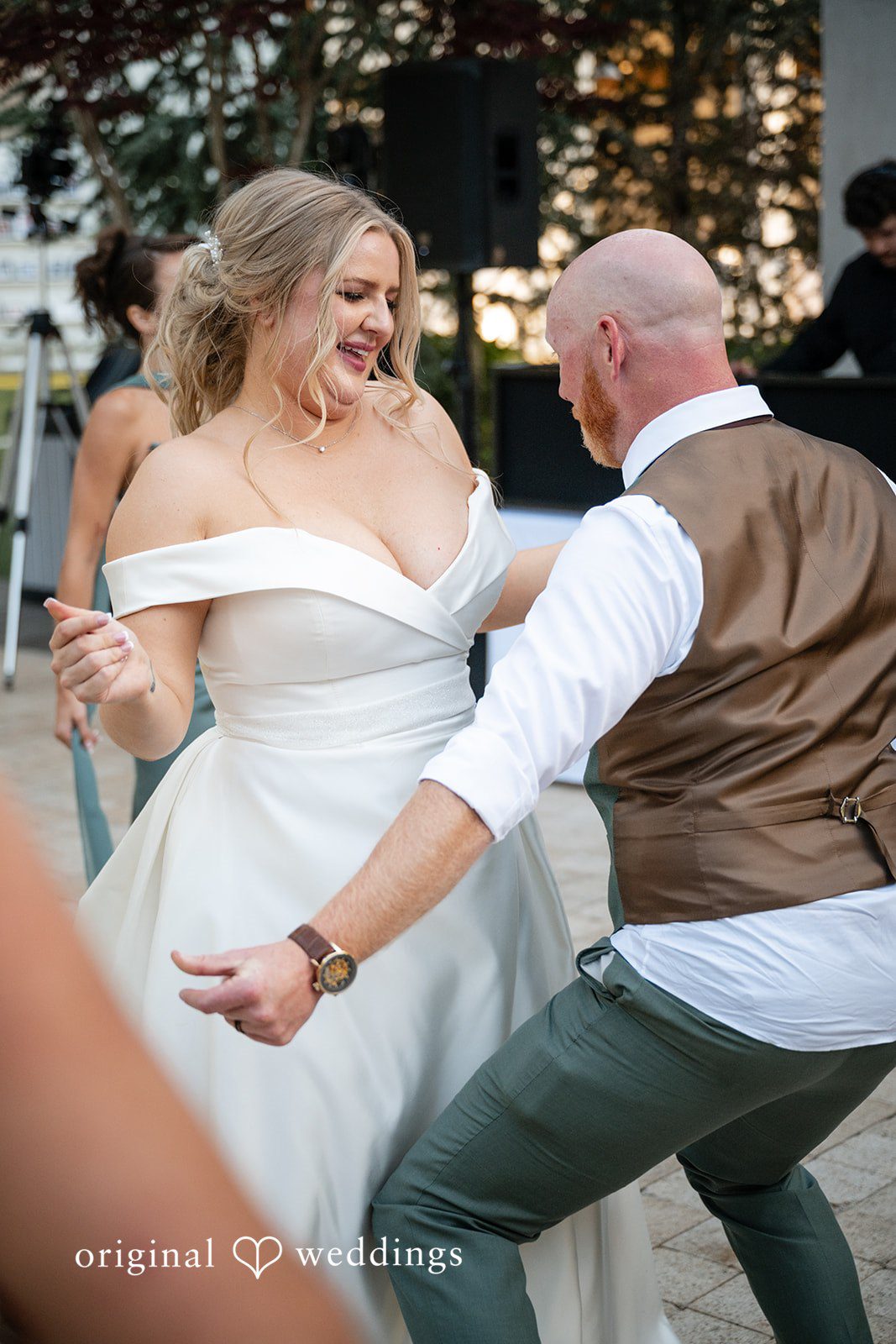 Victoria + Skyler Close-up of a bride laughing while dancing with the groom.
