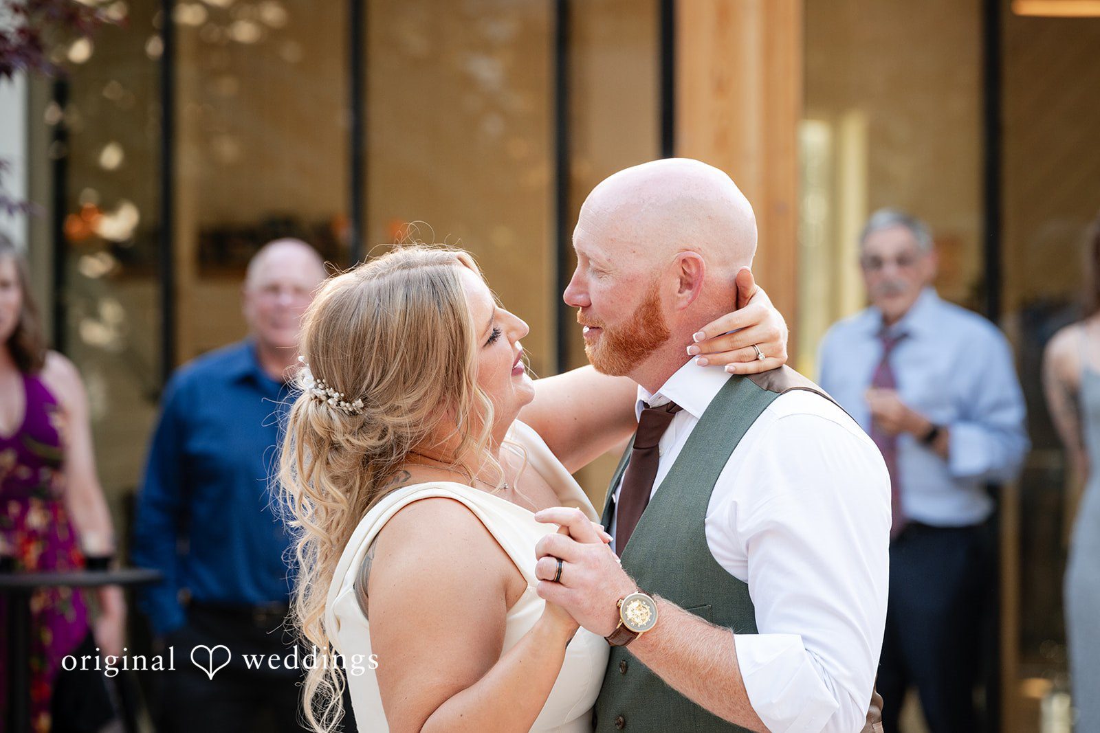 Victoria + Skyler Bride and groom looking at each other while slow dancing.