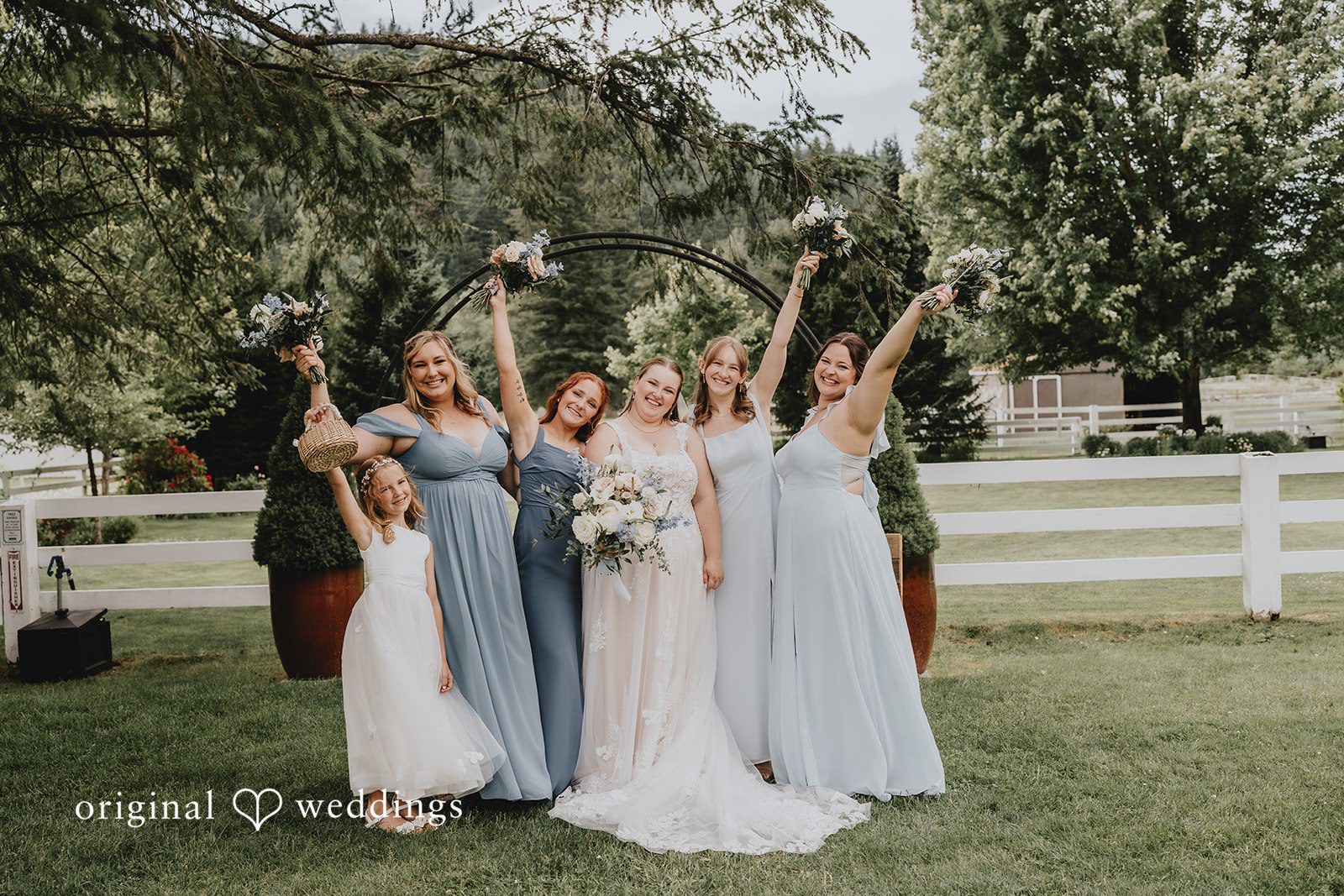 Natalie + DJ Group picture of bride with the bridesmaids, all holding bouquets