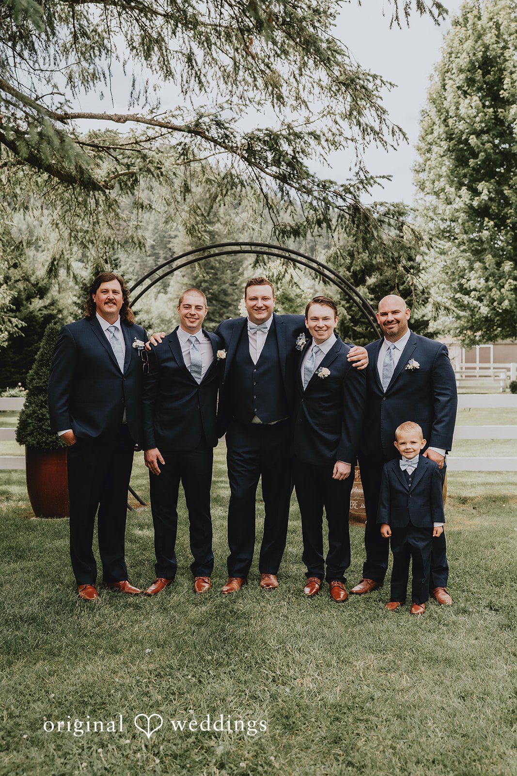Natalie + DJ Group picture of groom with groomsmen at Rein Fire Ranch wedding