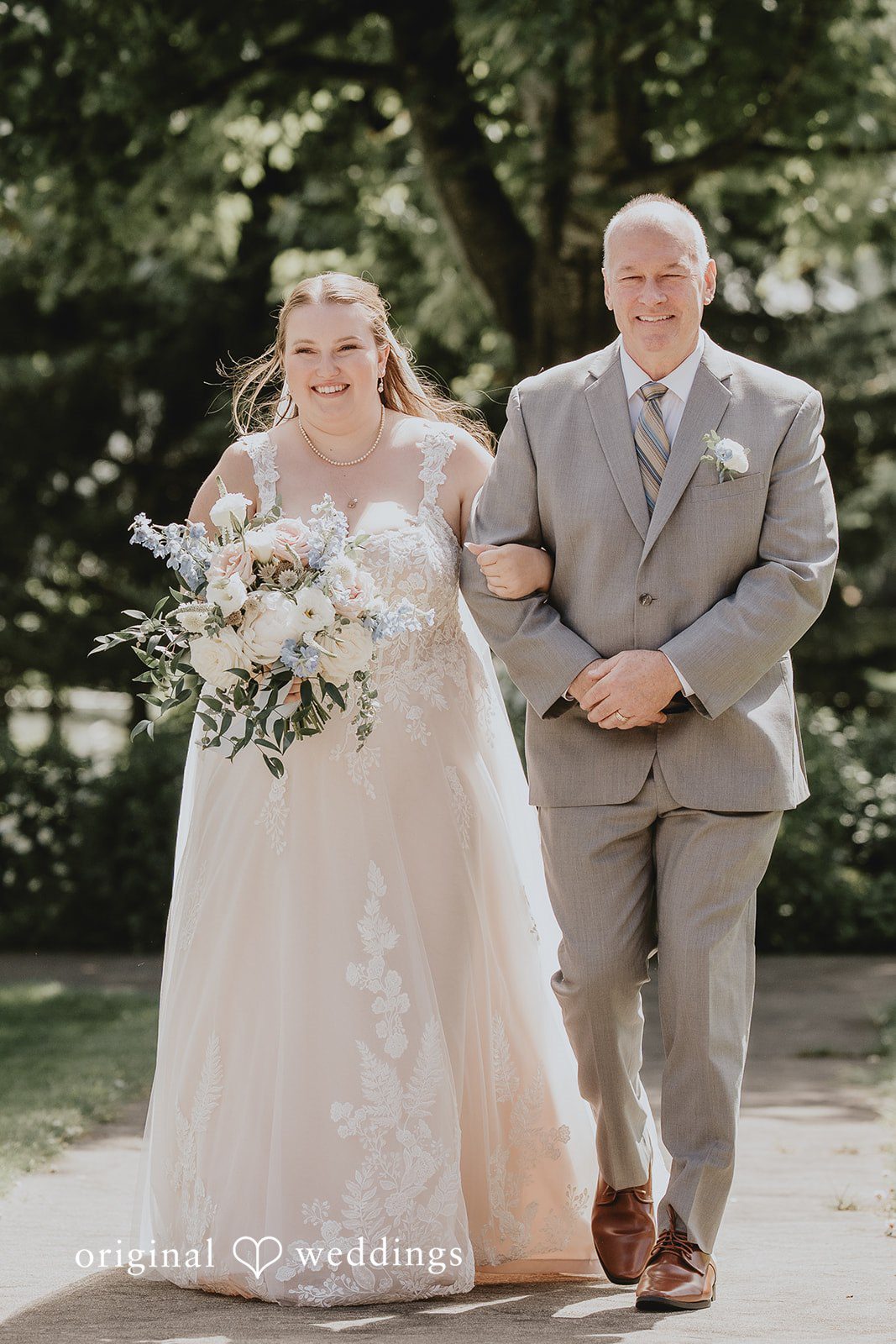 Natalie + DJ Lovely bride walking down the aisle with someone arms in arms for wedding ceremony