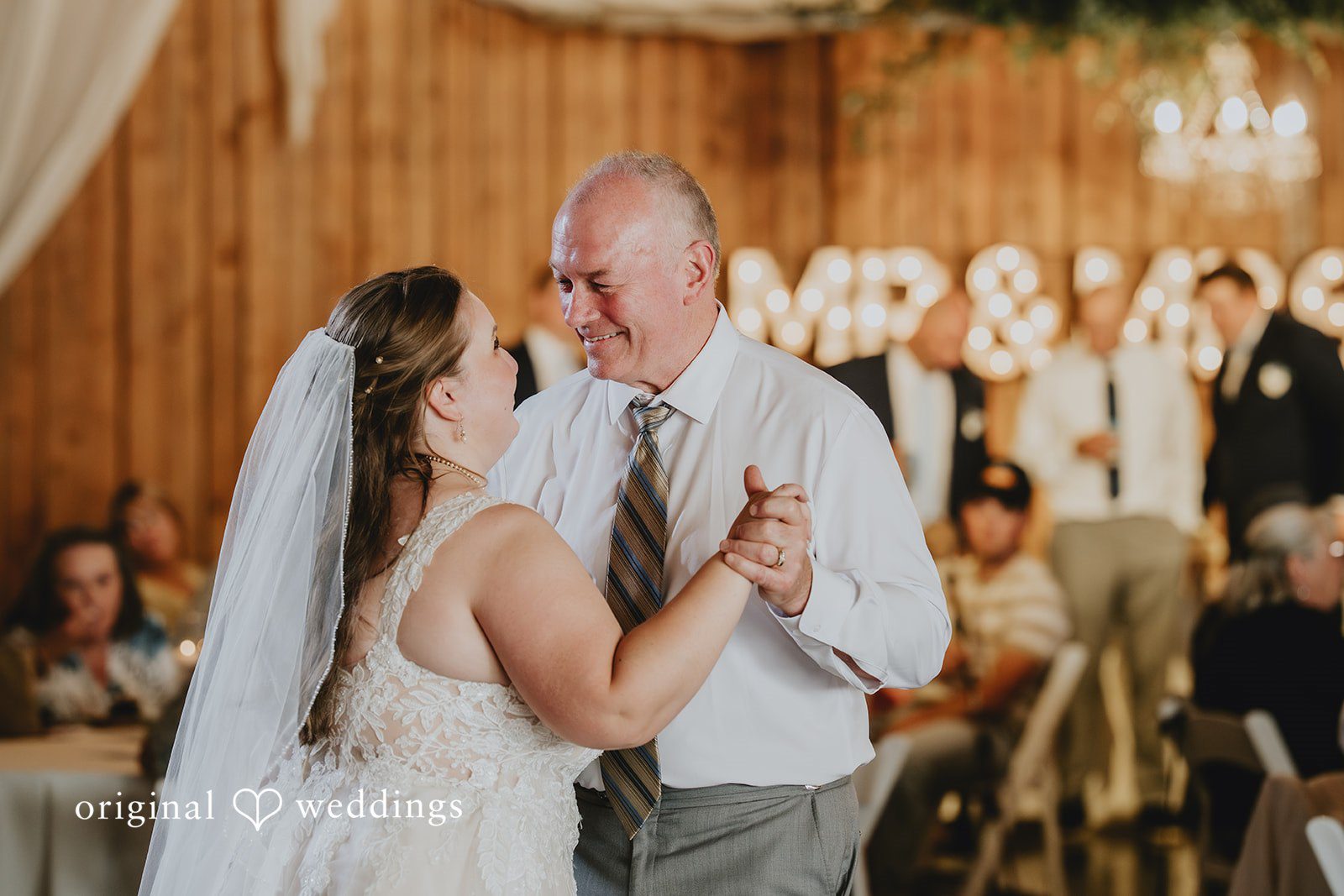 Natalie + DJ Bride sharing an emotional dance with someone
