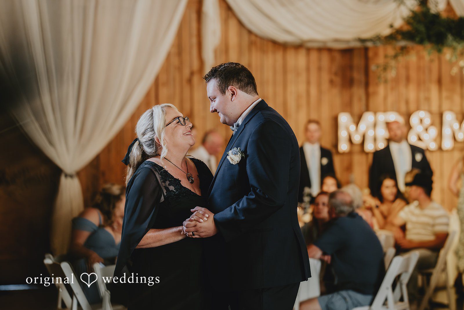 Natalie + DJ Groom sharing an emotional dance with someone