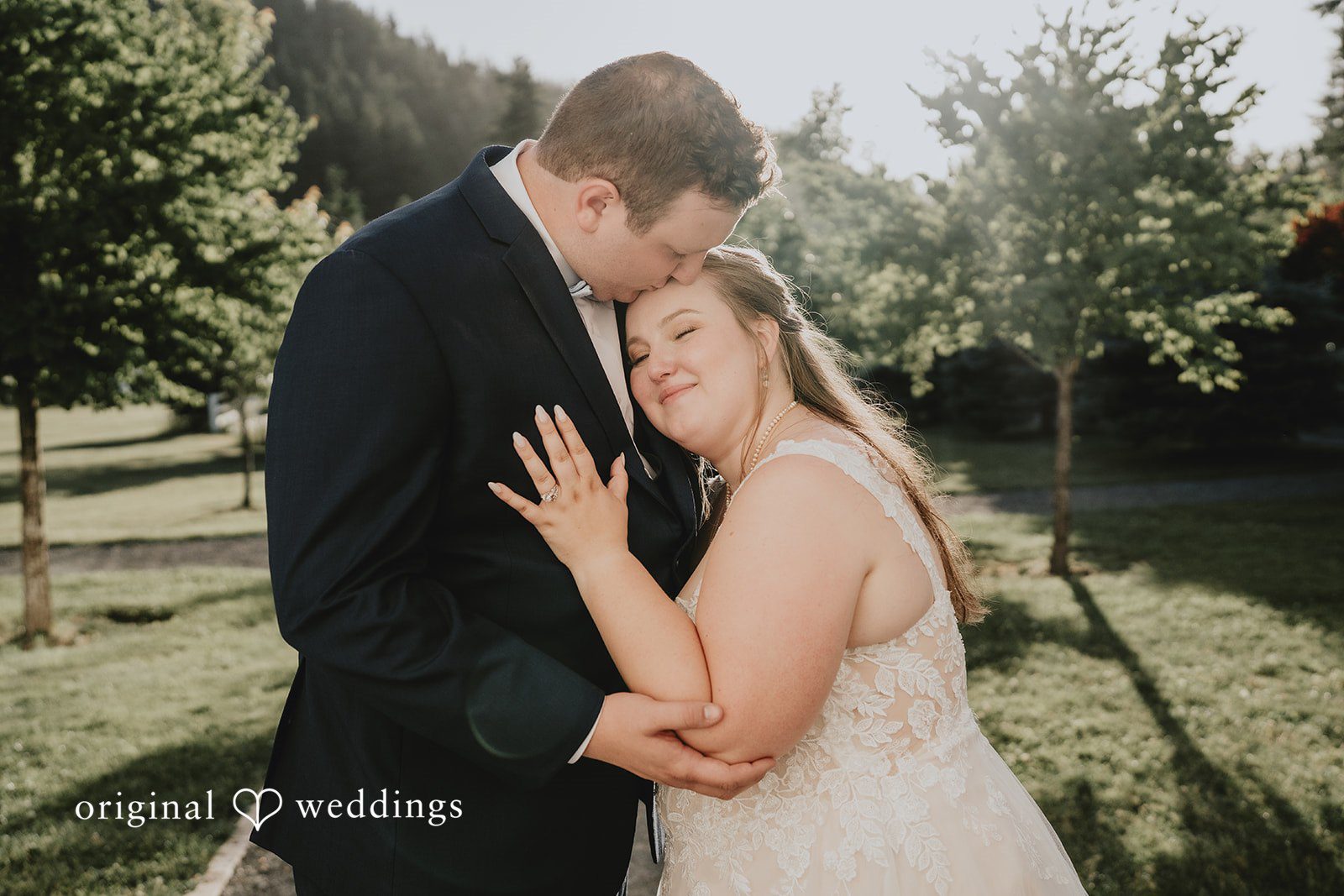 Natalie + DJ A candid hug and kiss moment captured by Seattle wedding photographers