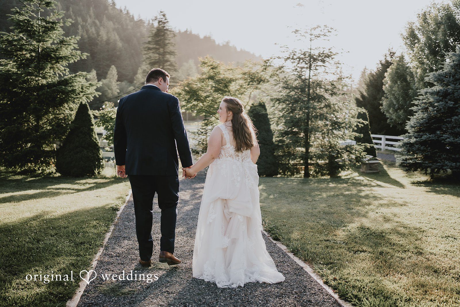 Natalie + DJ Bride and groom walking away after wedding ceremony at Rein Fire Ranch