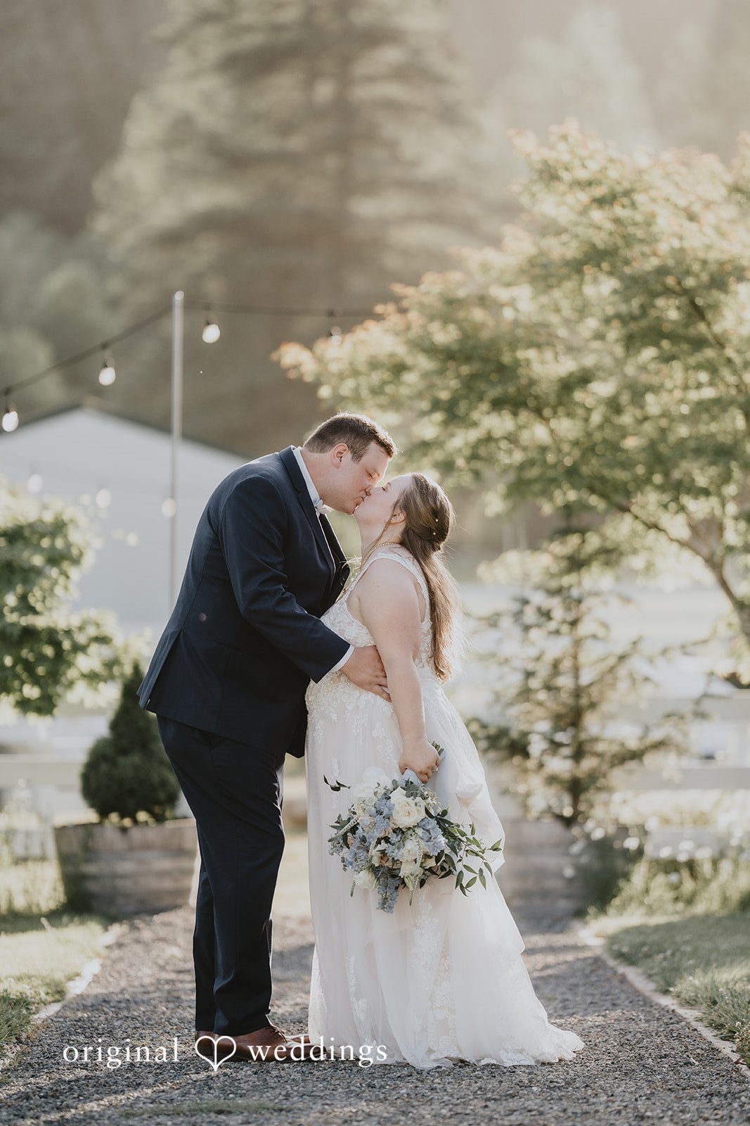 Natalie + DJ Seattle Wedding Photographers from Original Weddings capturing the romantic kiss moment of couple at Rein Fire Ranch