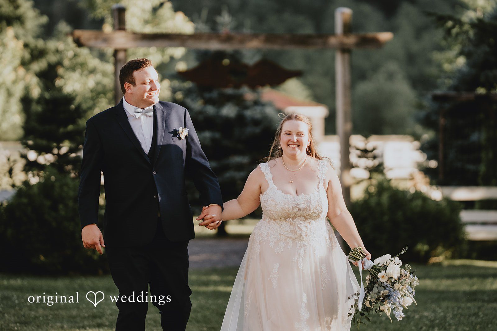 Natalie + DJ Bride ang groom walking hands in hands happily after wedding ceremony
