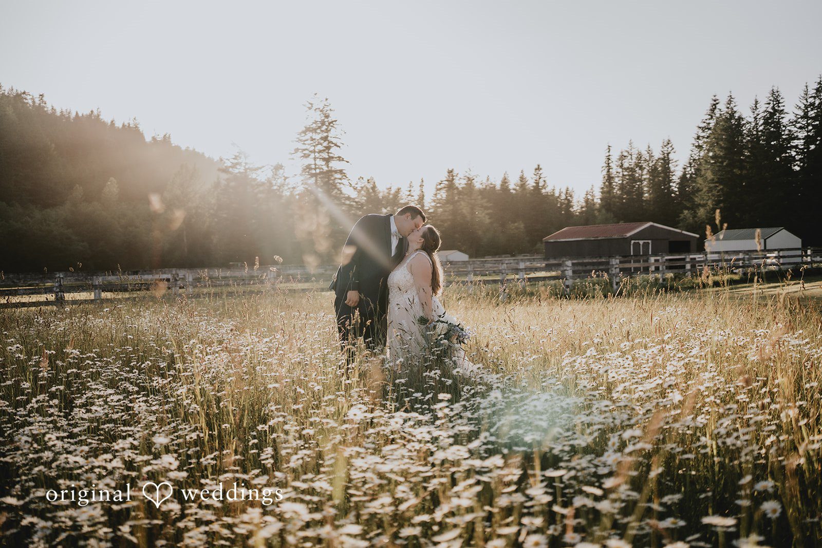 Natalie + DJ Stunning picture of bride and groom sharing a romantic kiss at Rein Fire Ranch