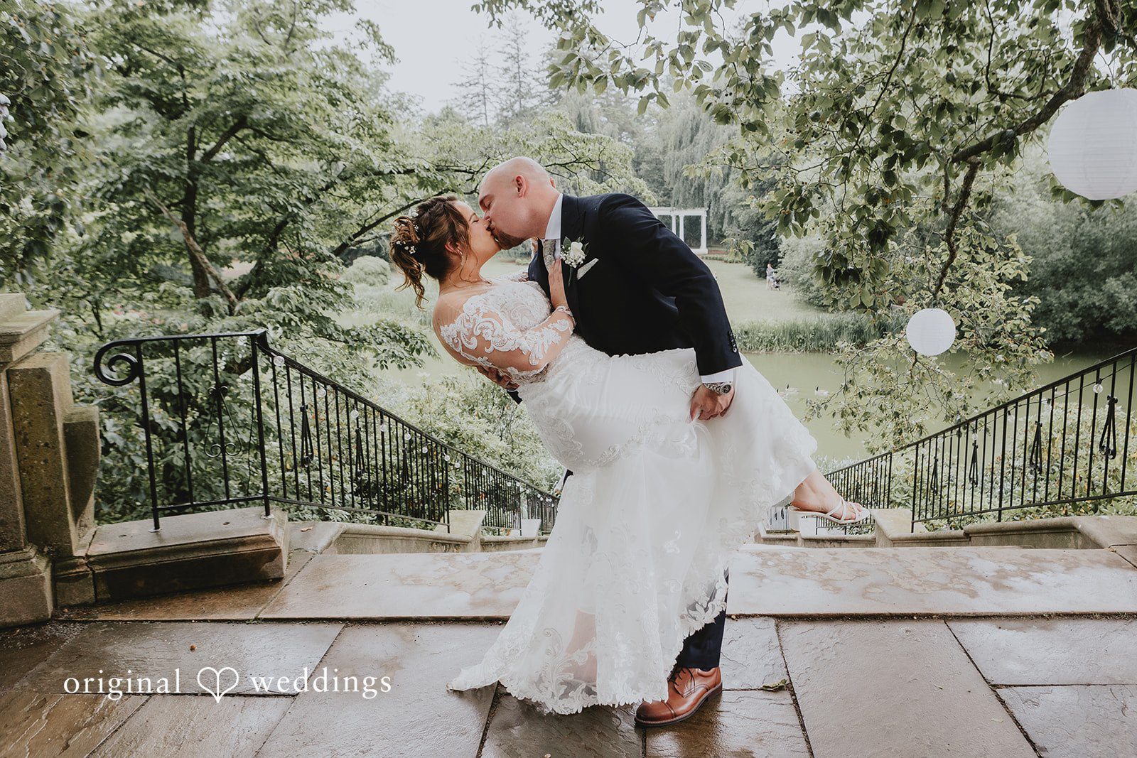 Samantha + Michael Groom lifting the bride into the air while kissing.