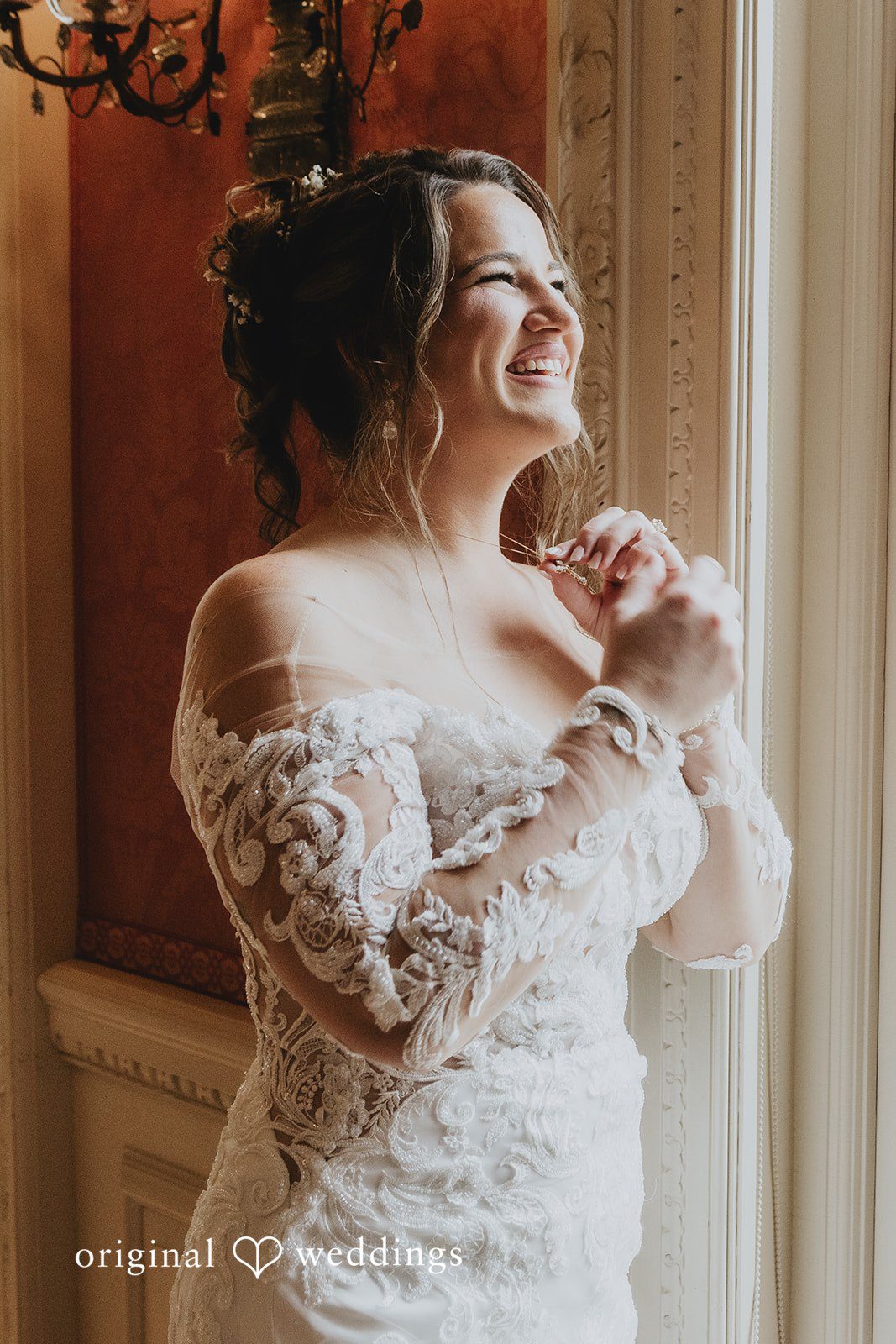 Samantha + Michael Close-up of a smiling bride in a lace wedding gown.
