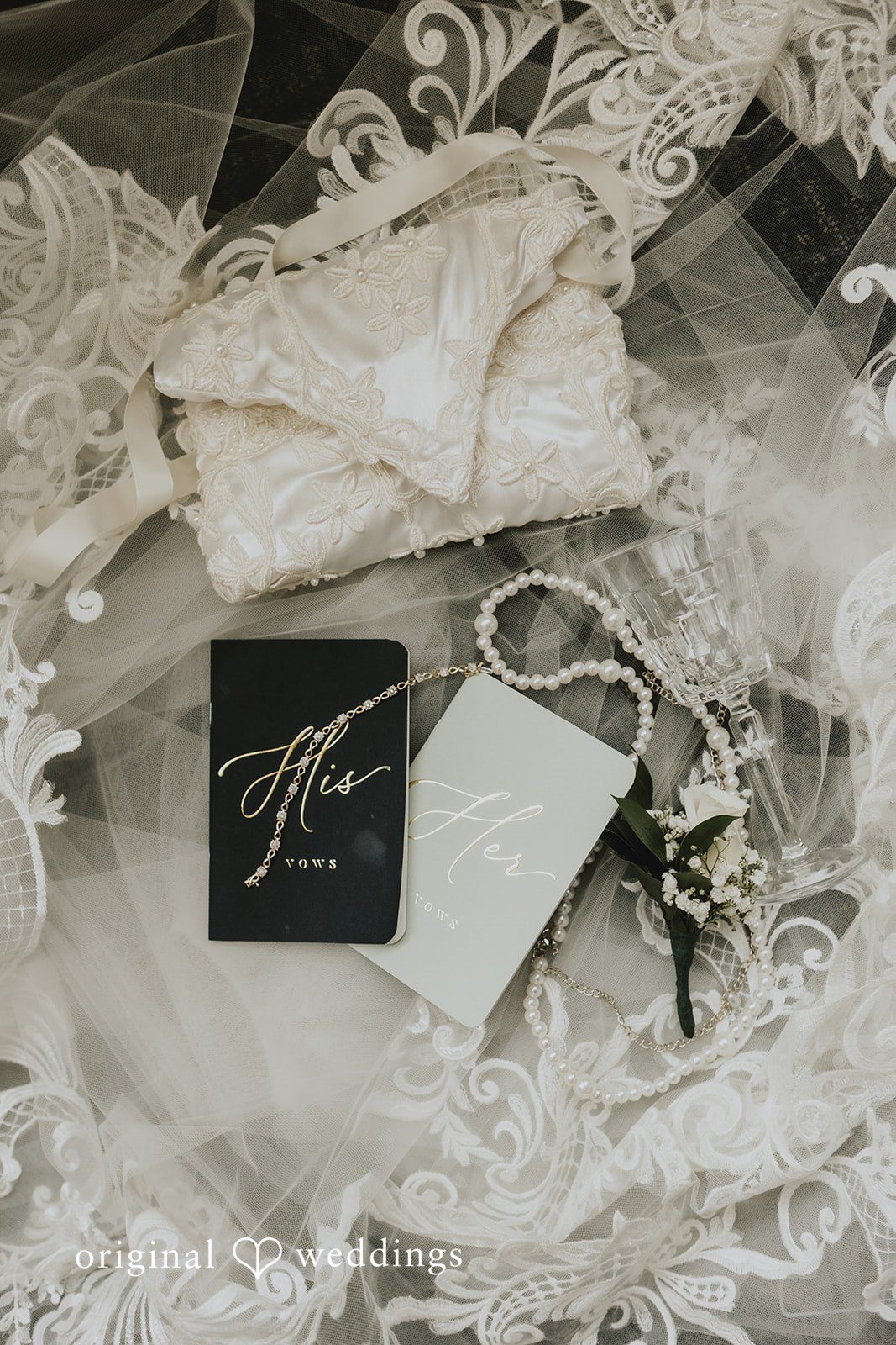 Samantha + Michael Flat lay arrangement of wedding rings and flat invitation suite.