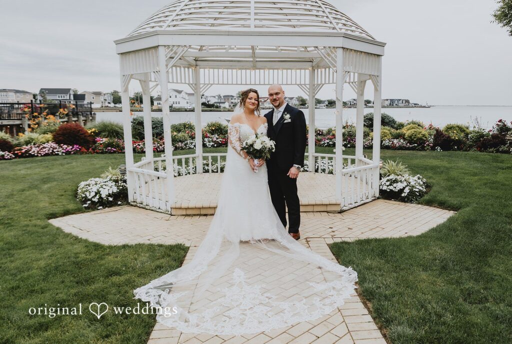 Samantha + Michael Stunning Portrait of couple at Riviera Waterfront Mansion by New York Wedding Photographers from Original Wedding.