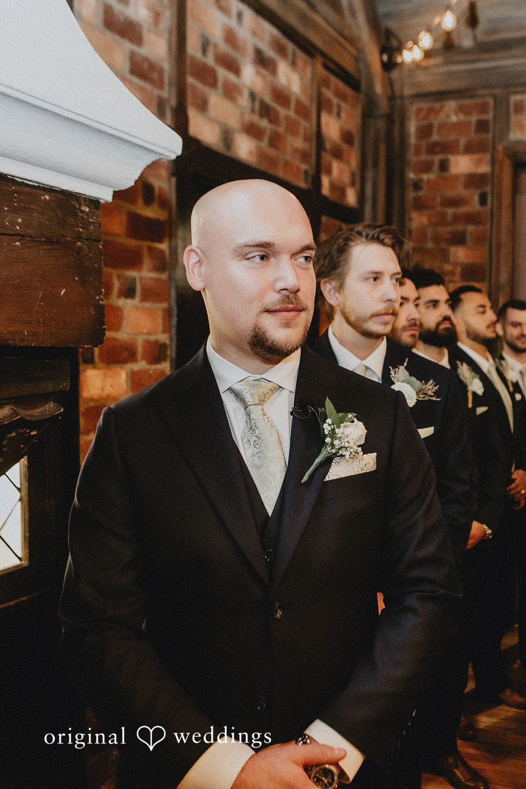 Samantha + Michael Close-up of a smiling groom in his wedding suit.