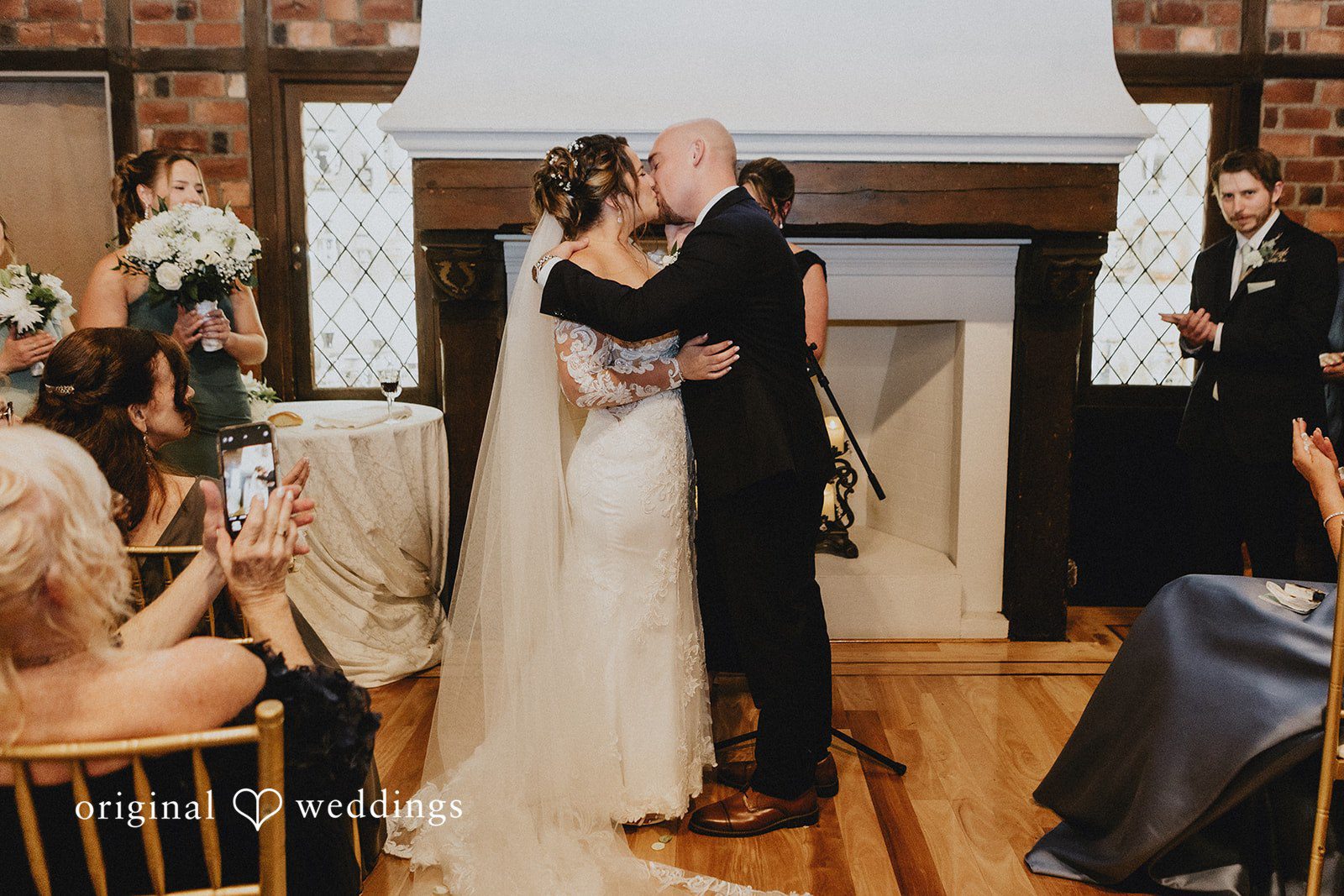 Samantha + Michael Bride and groom kissing at the end of their wedding ceremony.