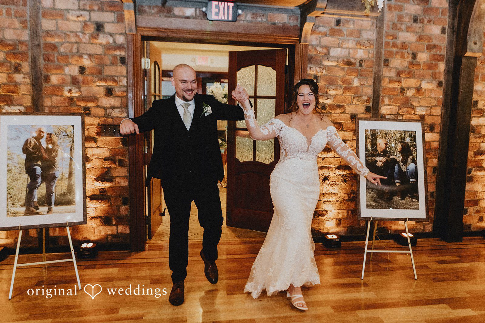 Samantha + Michael Bride and groom making a grand entrance into their reception with raised arms.