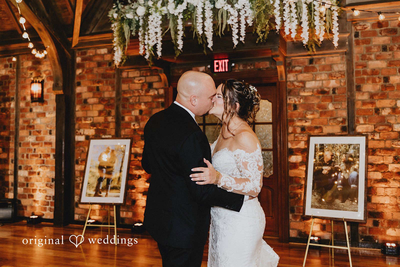 Samantha + Michael Bride and groom slow dancing under hanging string lights.