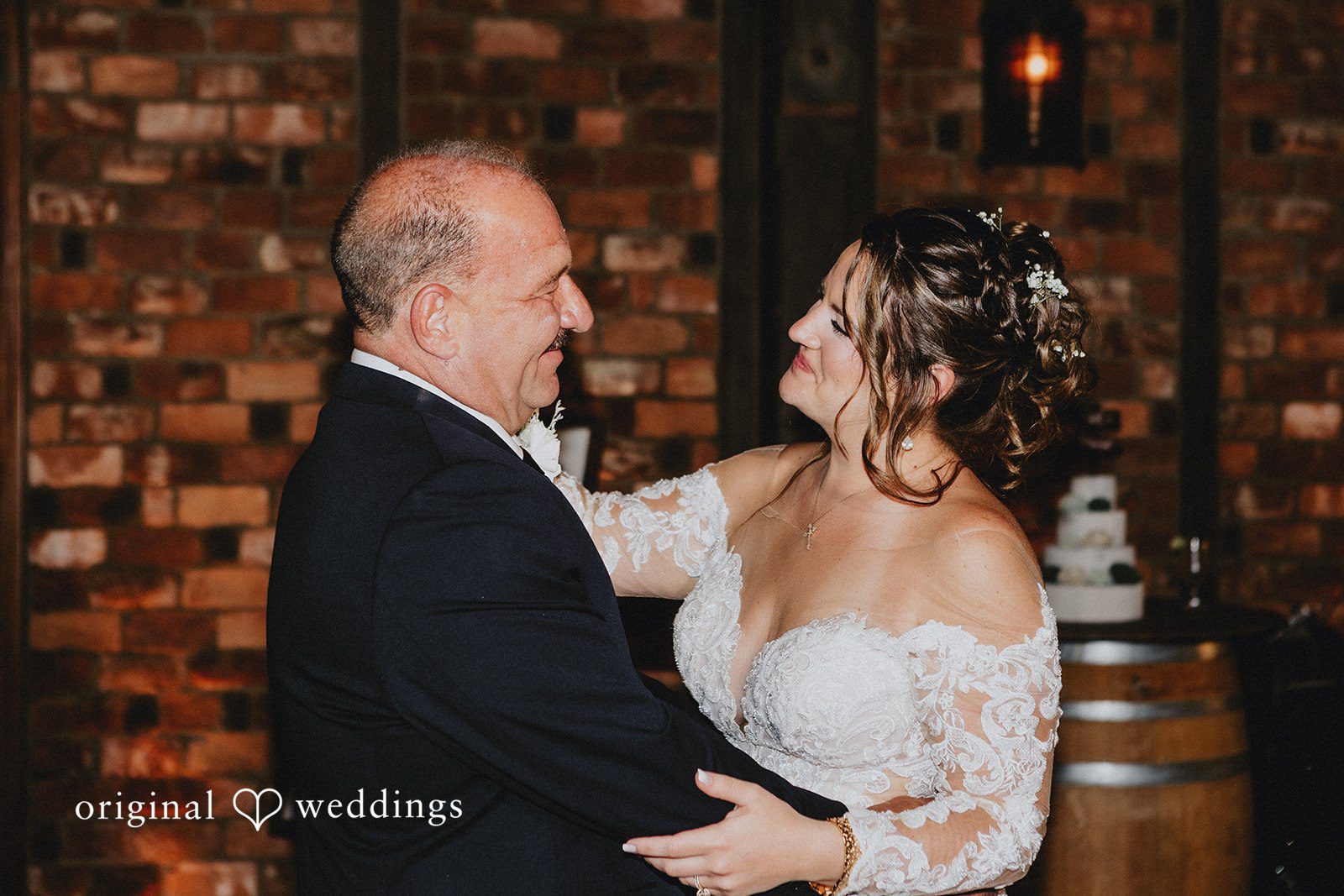 Samantha + Michael Bride sharing a dance with an older smiling man.