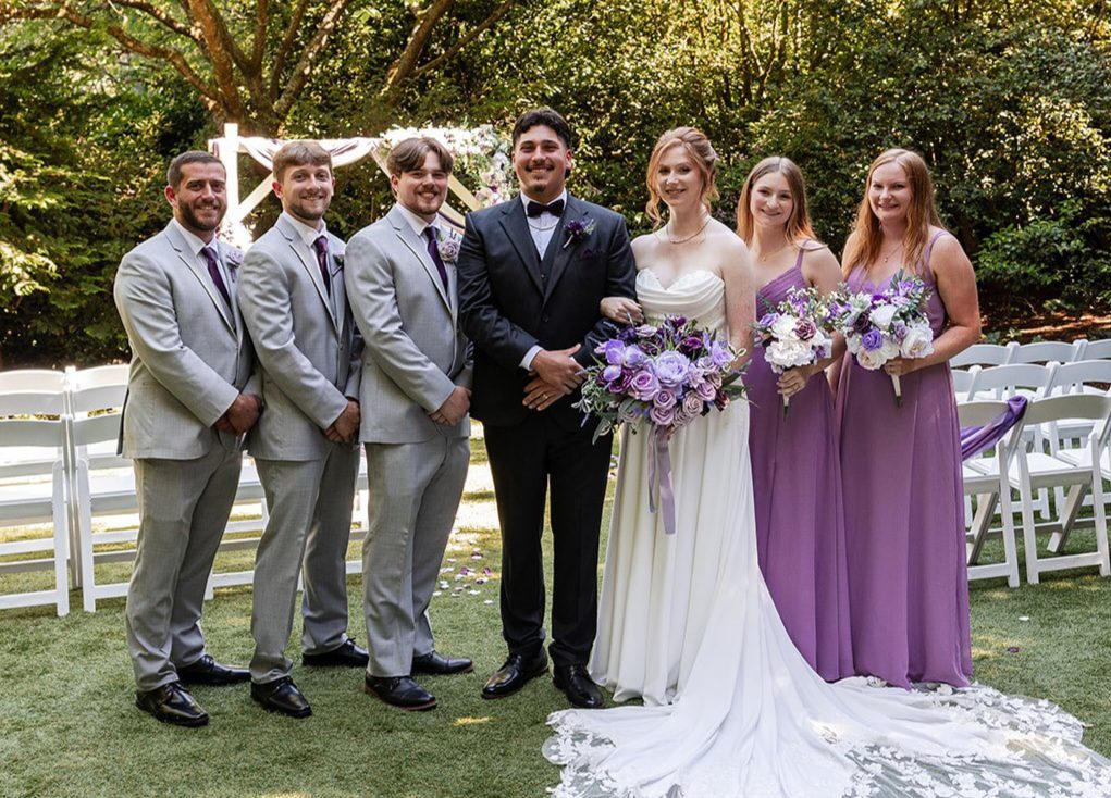 Our Seattle wedding photographers at Original Weddings captured a stunning portrait of the couple and their bridal party at Robinswood House