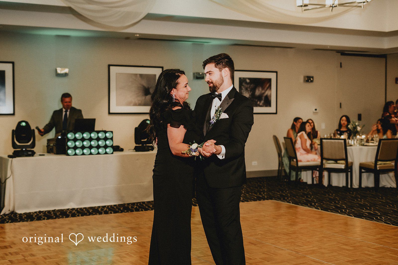Brandon + Natalie A women and groom dancing together at a reception.