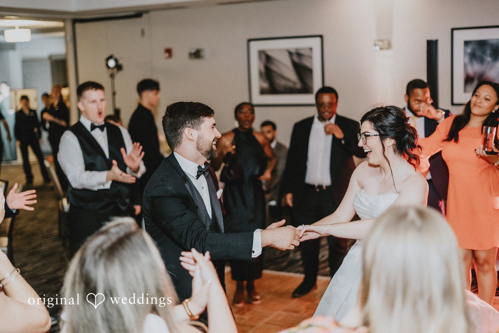 Brandon + Natalie Guests dancing and celebrating together on a reception dance floor.