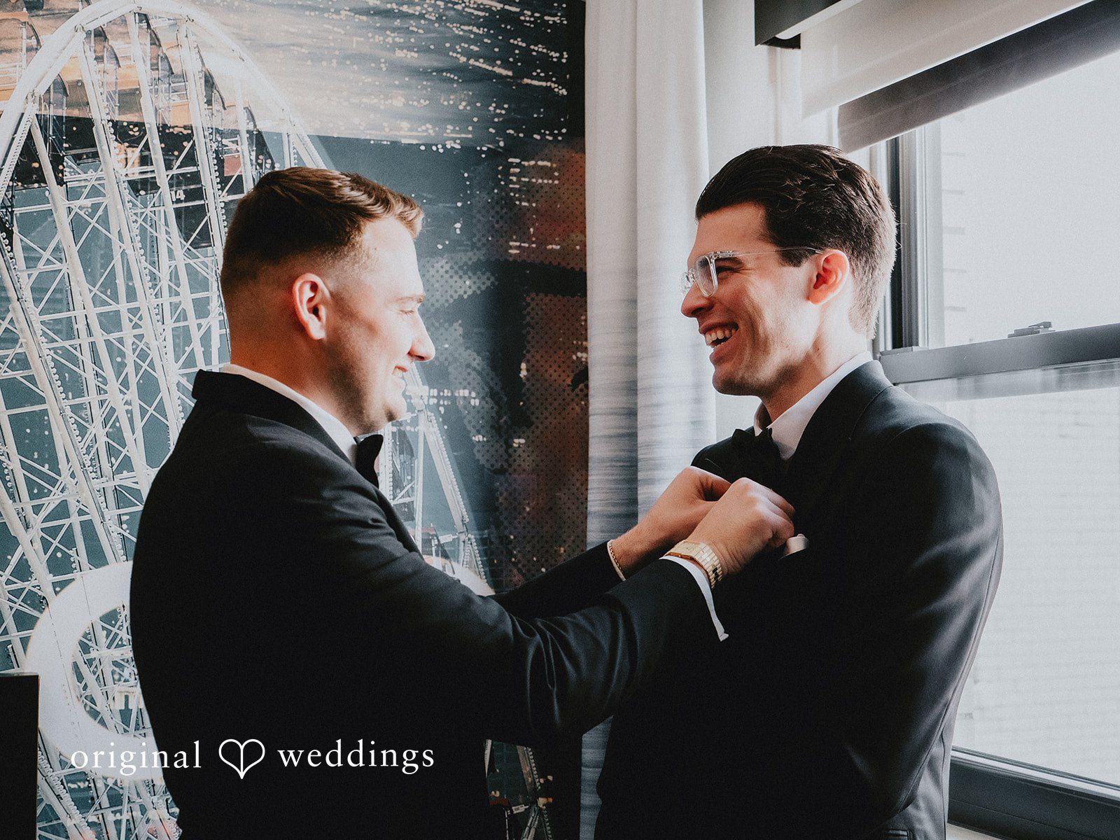 Aleksandar + Anna A groom adjusting the collar of a groomsman's suit jacket.