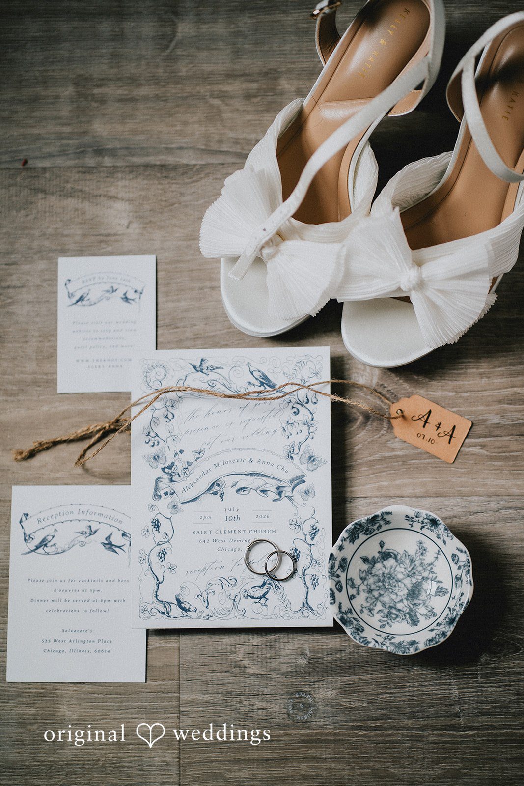 Aleksandar + Anna A flat lay display of wedding stationery, invitations, and bridal shoes.