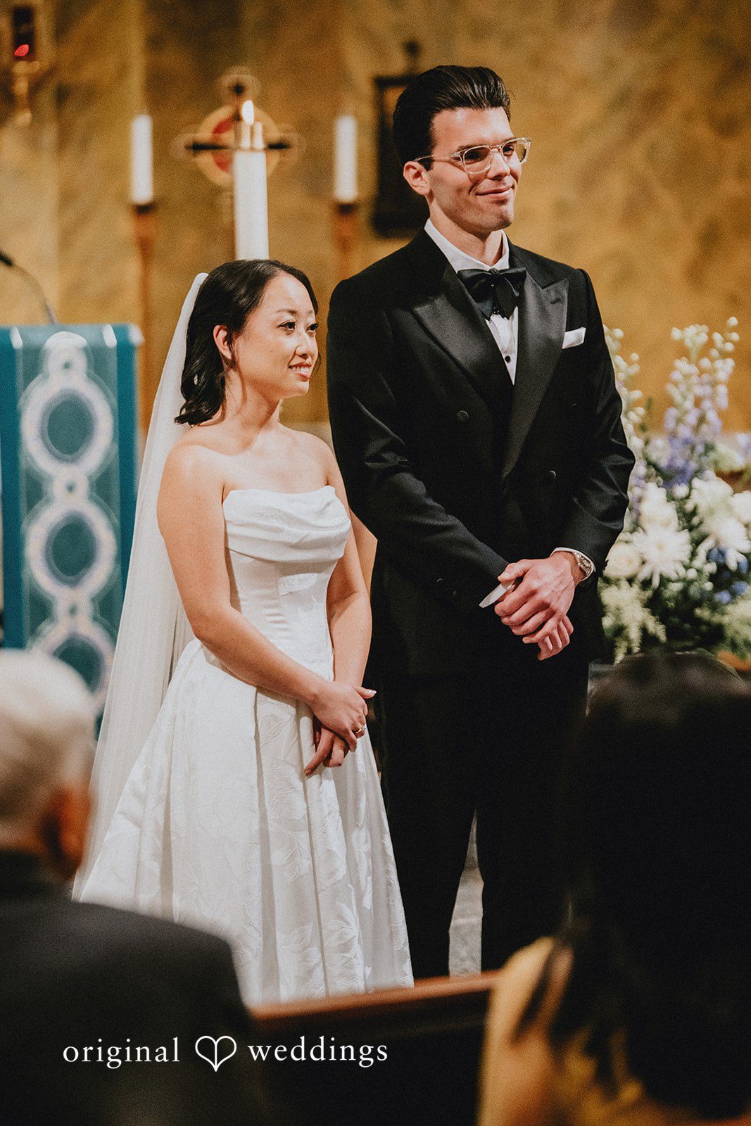 Aleksandar + Anna A bride and groom standing together during their wedding ceremony.