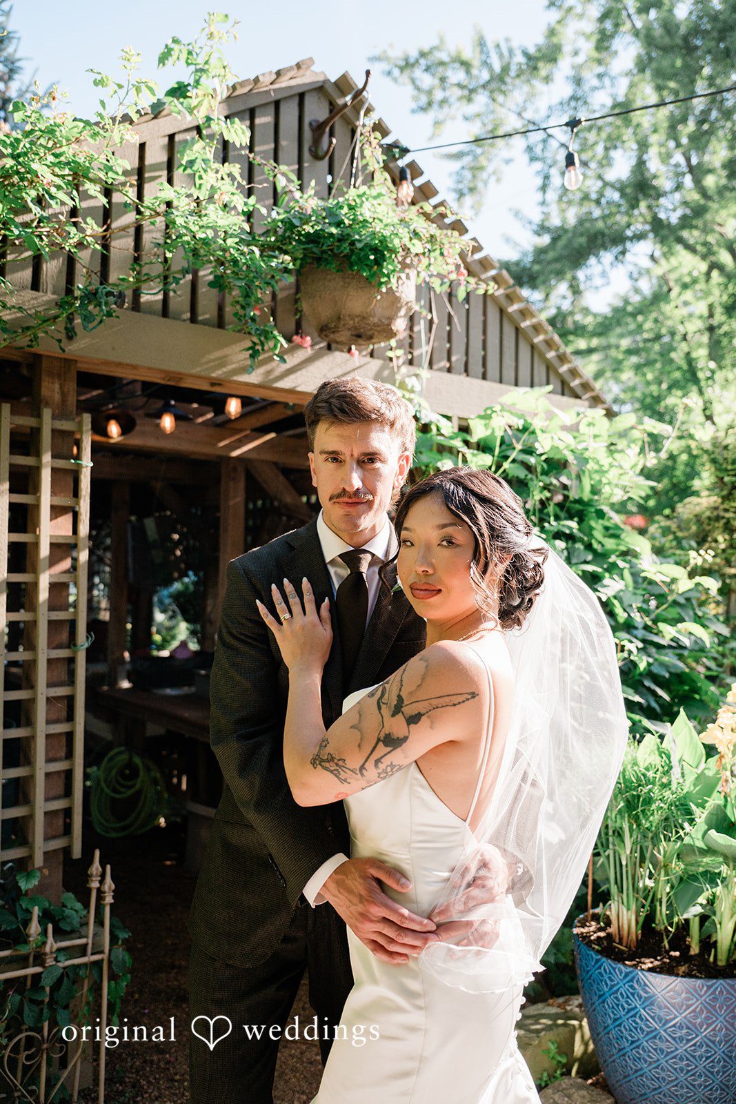 Lauren + Brinton Stunning Portrait of couple at Sanger House Gardens by Milwaukee Wedding Photographers from Original Weddings.