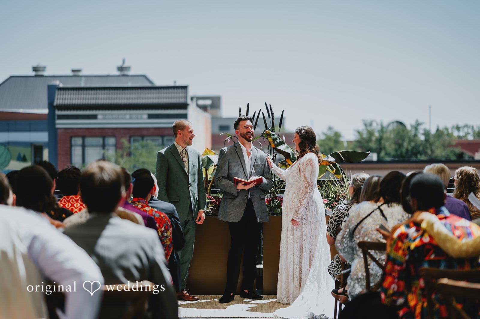 Elizabeth + Willis Wide shot of a wedding ceremony in progress with seated guests.