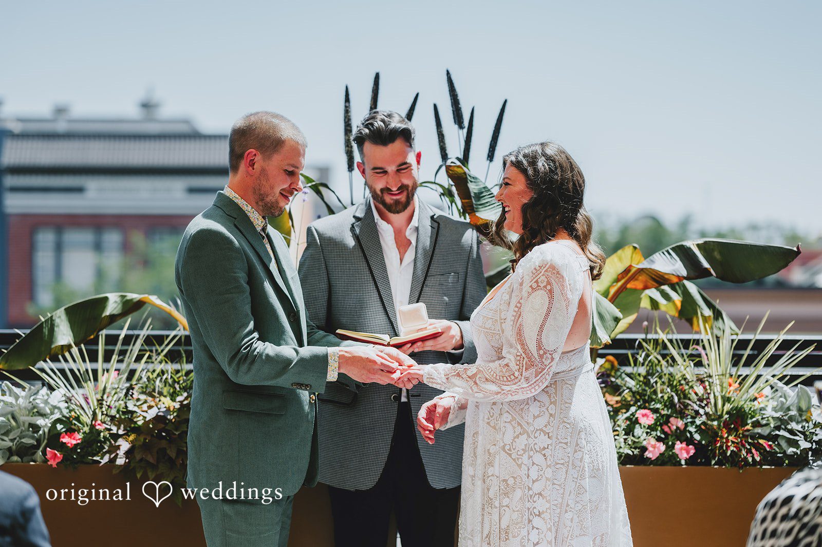 Elizabeth + Willis Bride and groom holding hands while exchanging vows during their ceremony.
