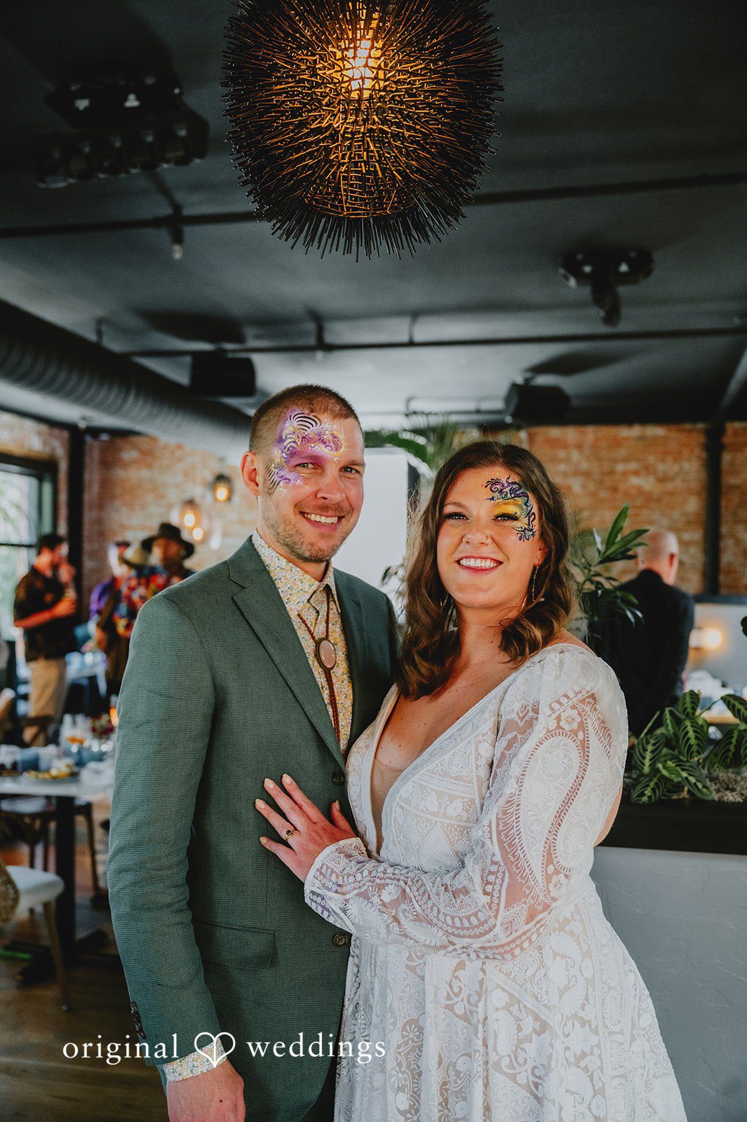 Elizabeth + Willis Newlywed couple posing together and smiling directly at the camera.